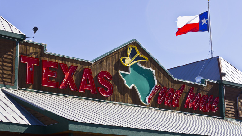 Texas Roadhouse logo on the facade of one location.