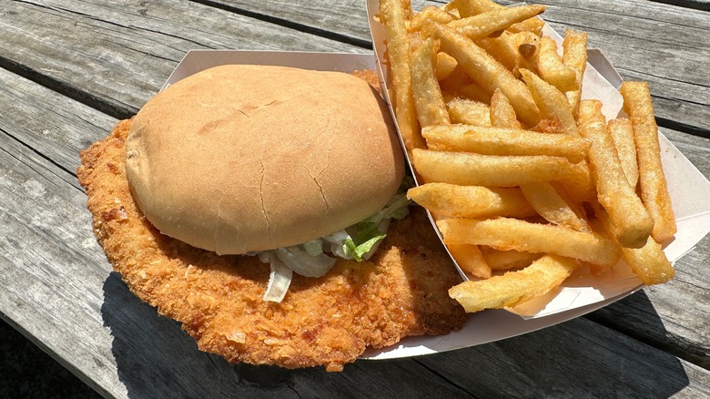 fried pork tenderloin sandwich with fries