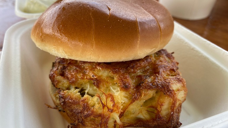 crab cake sandwich in takeout box