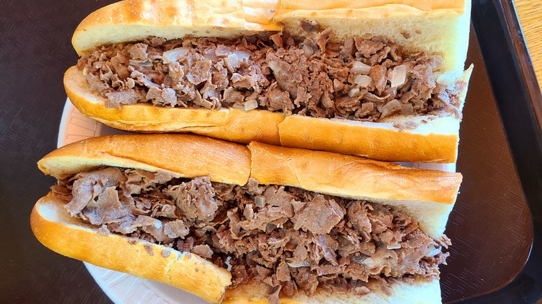 two Philly cheesesteak sandwiches