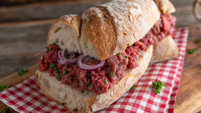 raw beef sandwich on french bread