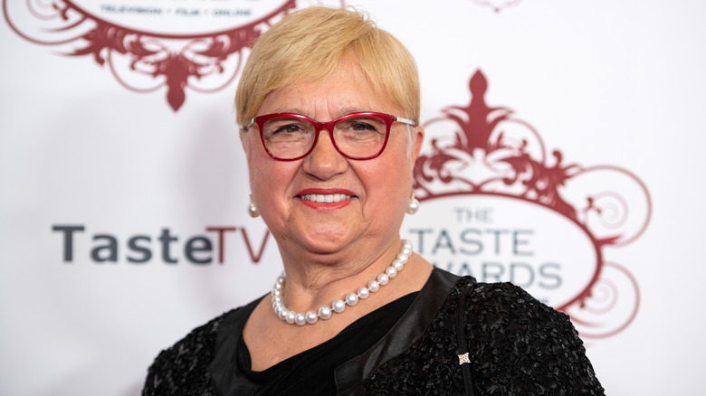 Lidia Bastianich in red glasses and pearl necklace