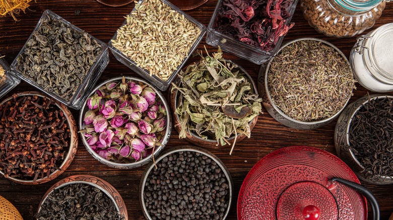 Different types of tea arrayed in glass containers