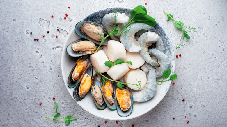 Frozen mussels, scallops, and shrimp in bowl
