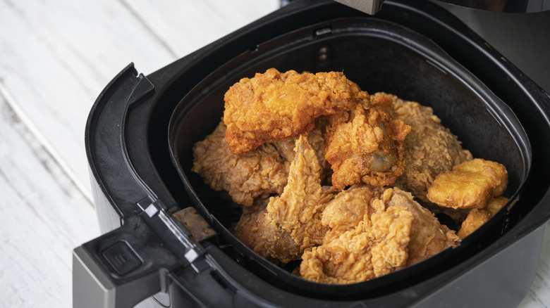 Air fryer with crispy chicken inside