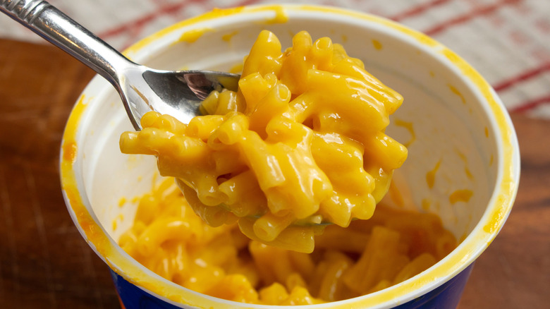 A closeup of a cup of prepared Kraft Easy Mac microwave macaroni and cheese
