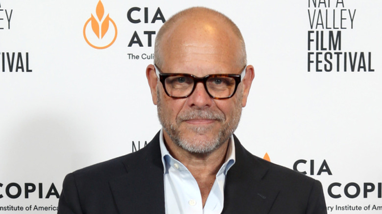 Alton Brown in suit and glasses at film festival