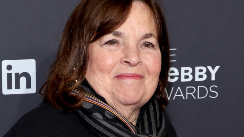 Ina Garten smiles in a striped scarf at an event
