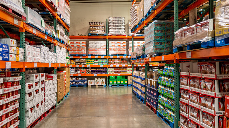Packaged foods line the shelves in a stocked Costco aisle