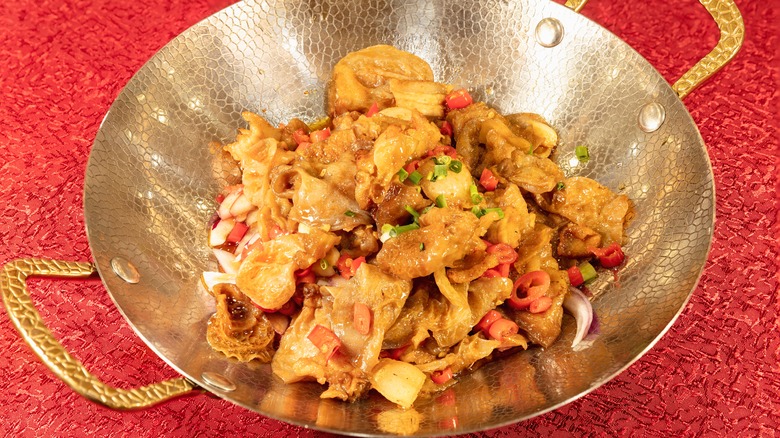 Stir-fried chitterlings, also known as chitlins, in a small wok