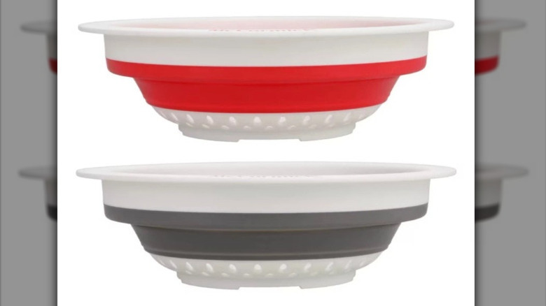 The red and gray McCormick colanders against a white background