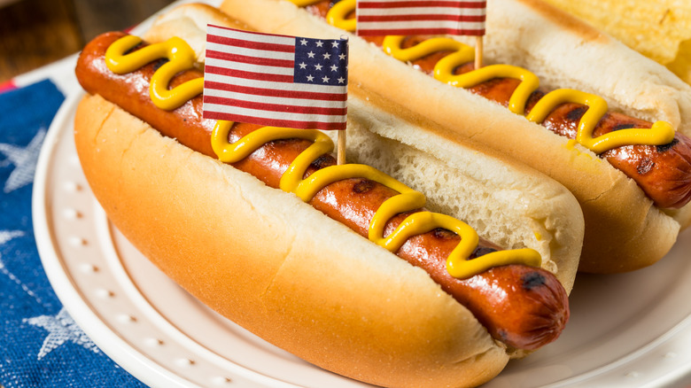 hot dog with mustard and American flag toothpick