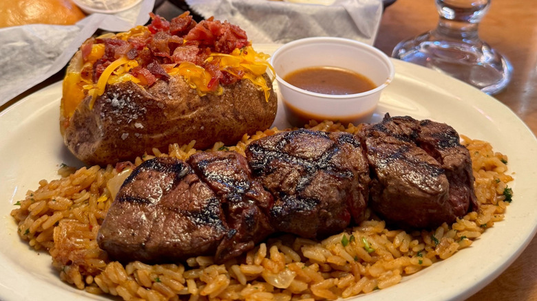Steak medallions, rice, and potato at Texas Roadhouse