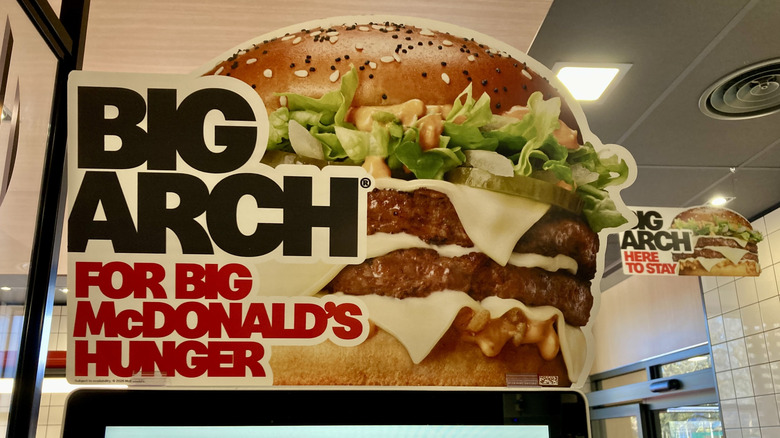 big arch burger sign inside mcdonald's