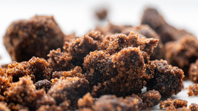 A close-up of clump sof muscovado sugar