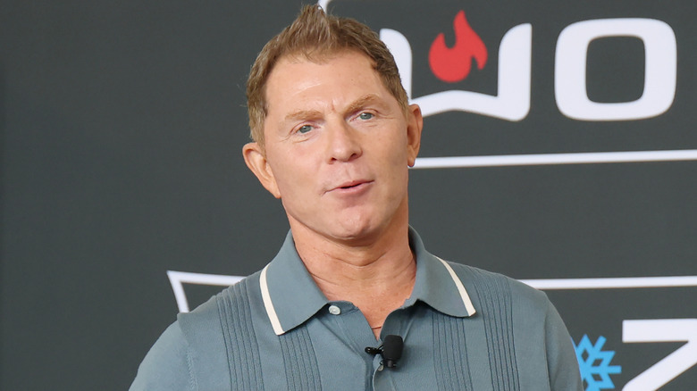 Bobby Flay speaking at a public cooking event