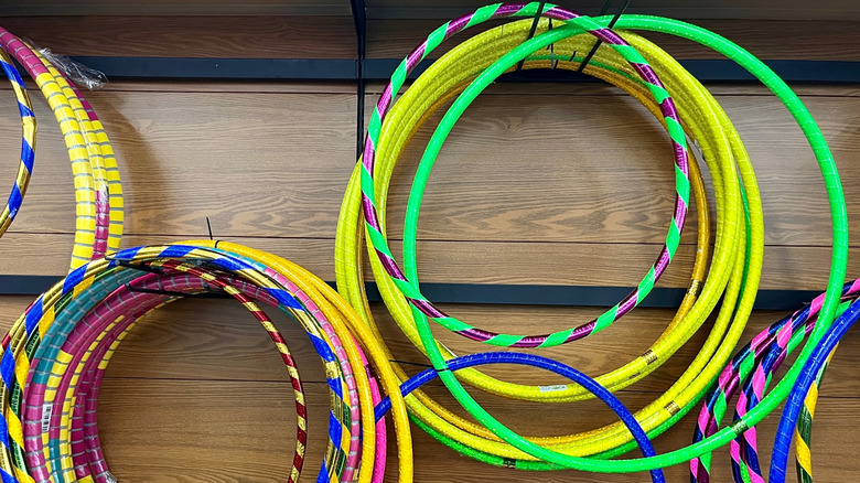 A wall with hula hoops on display