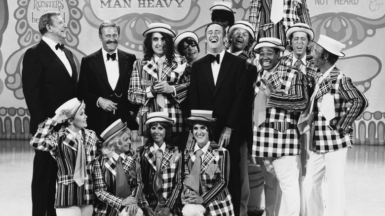 Cast of Laugh-In laughing