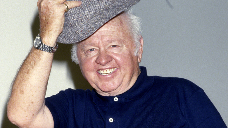 Mickey Rooney tipping his hat