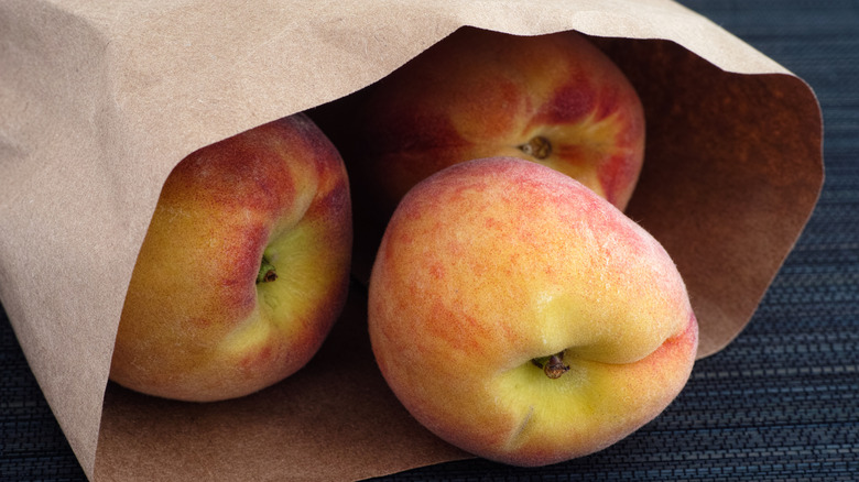 peaches in a paper bag