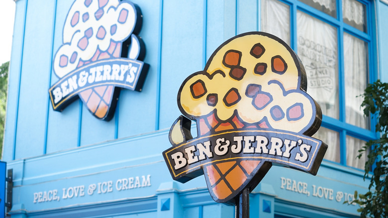 The exterior of a Ben & Jerry's ice cream parlor with signage.