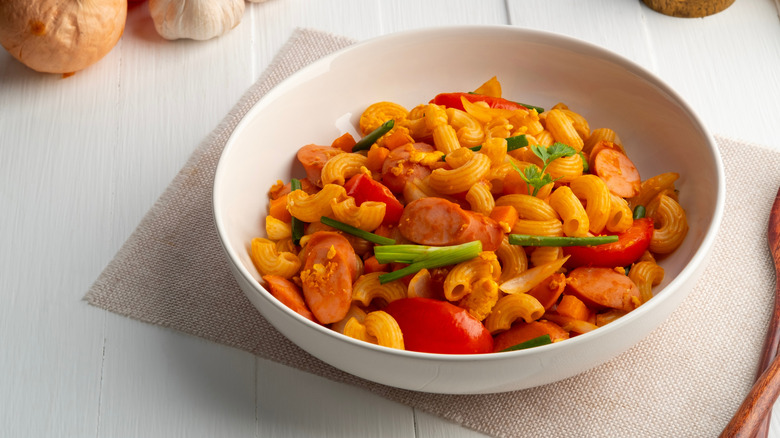 Macaroni with tomatoes, sausage, and green onions