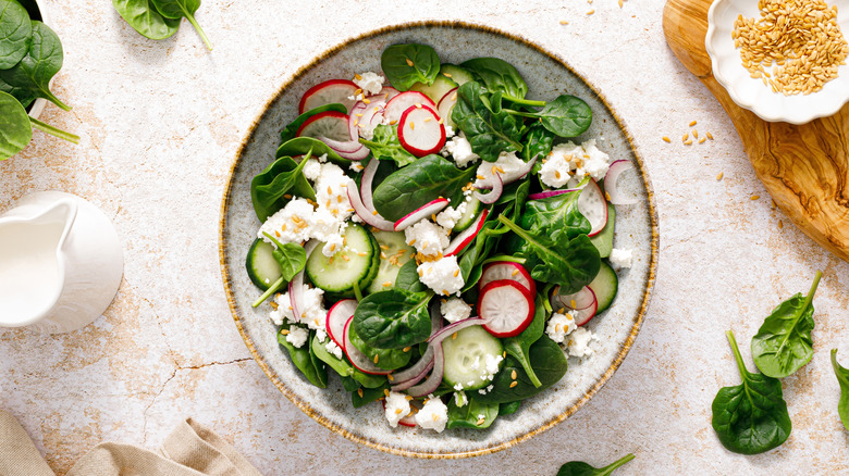 spinach salad with red onion and cheese