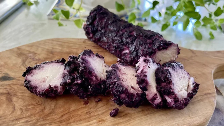 Aldi blueberry goat cheese log on wooden cutting board