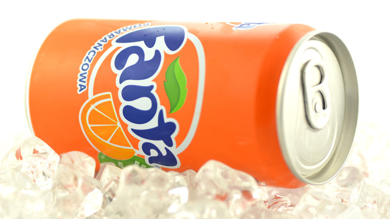 Can of Fanta on its side on ice