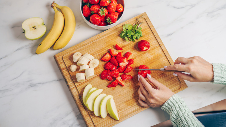 preparing fruit for fruit salad