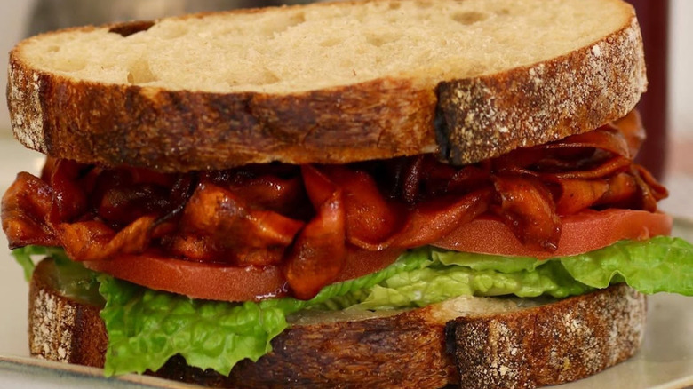 Vegan BLT sandwich with lettuce, tomato, and carrot bacon