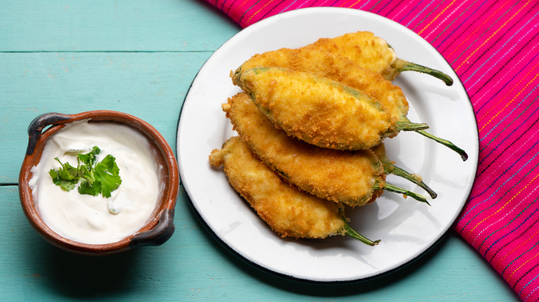 fried jalapeño poppers on a white plate