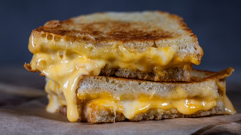 Two halves of a grilled cheese sandwich, stacked on top of each other