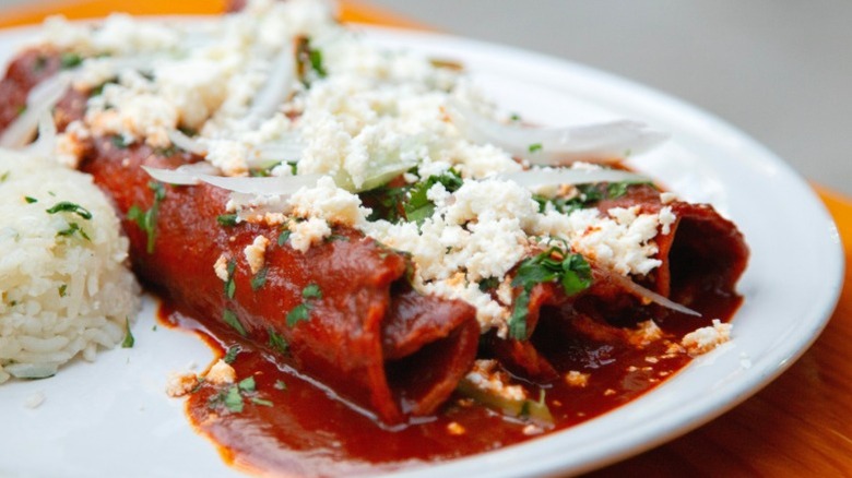 Traditional Mexican enchiladas with crumbled Oaxaca cheese