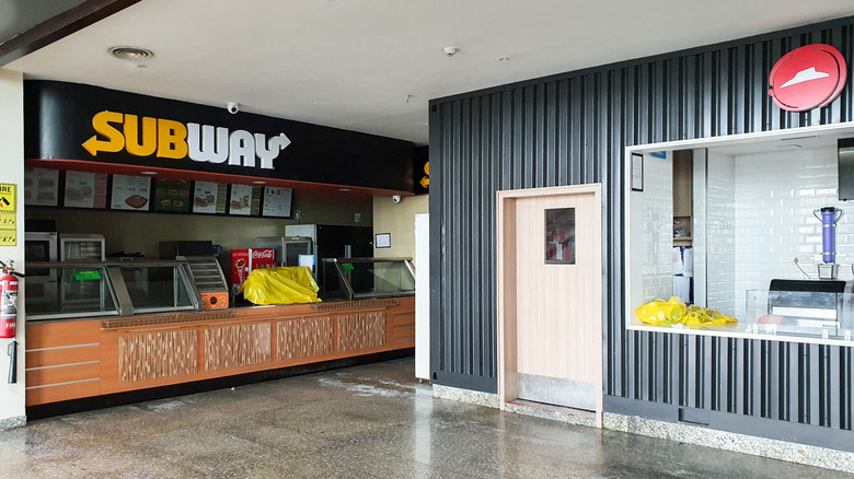 A food court that contains Subway and Pizza Hut