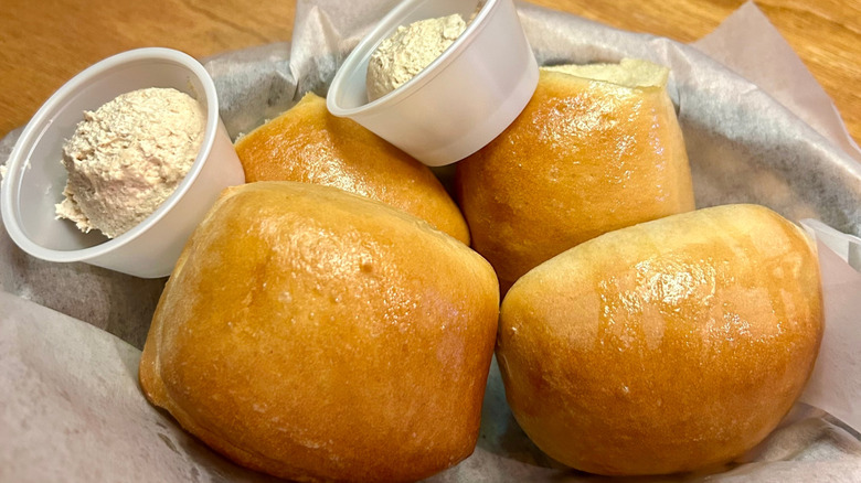 A basket of rolls and cinnamon butter at Texas Roadhouse
