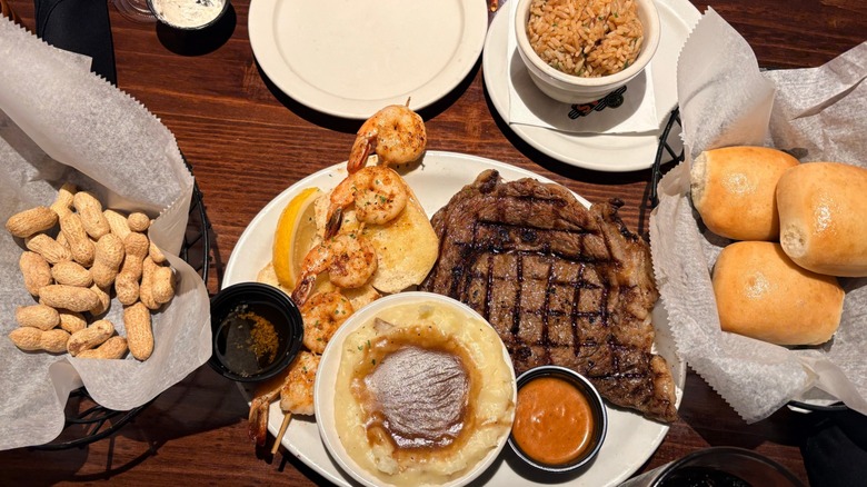 Steak, shrimp, mashed potatoes, peanuts, rolls at Texas Roadhouse