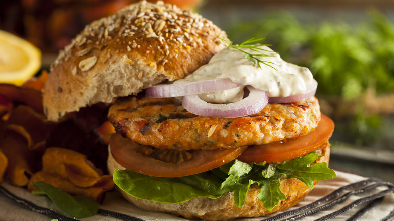 A fish burger served with tartar sauce