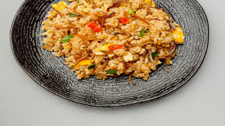 fried rice on a black plate