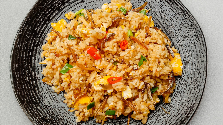 fried rice on a black plate