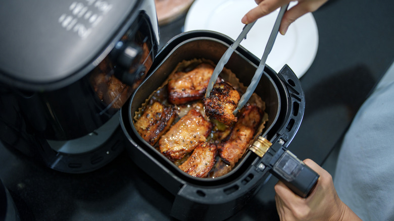 Freshly grilled pork belly with a golden-brown, crispy exterior cooked in an air fryer.