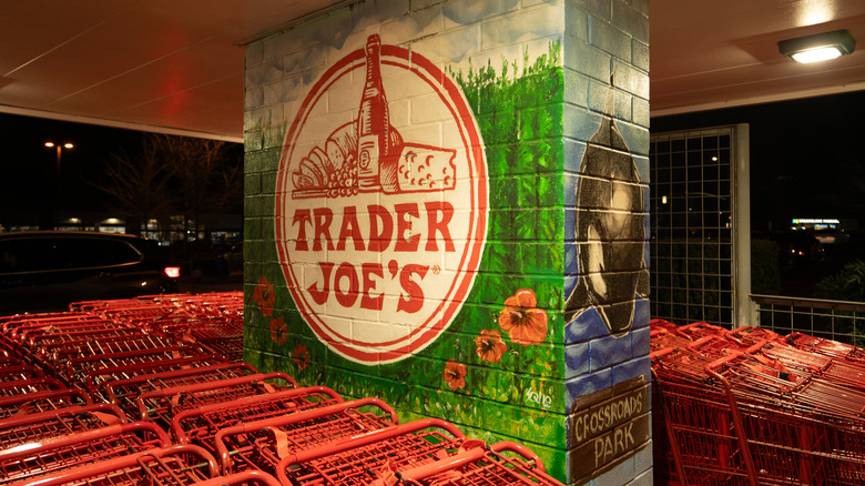 A painted Trader Joe's mural with shopping carts outside the store