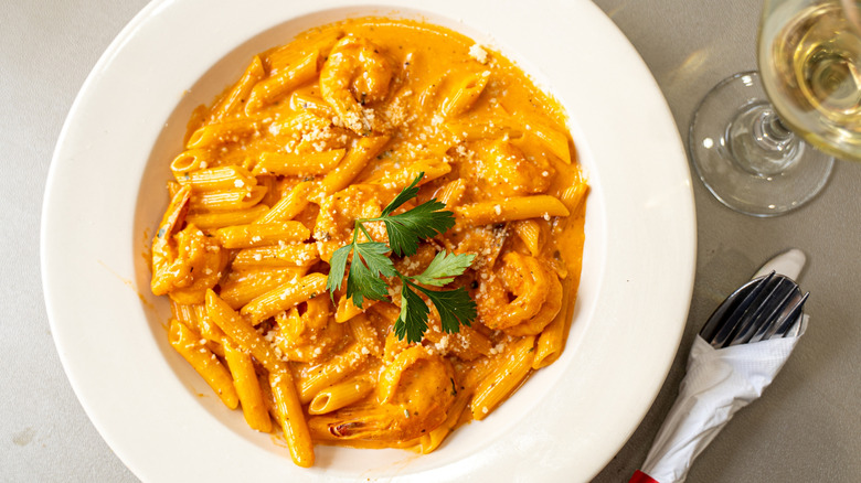 Penne pasta with creamy tomato sauce and shrimp