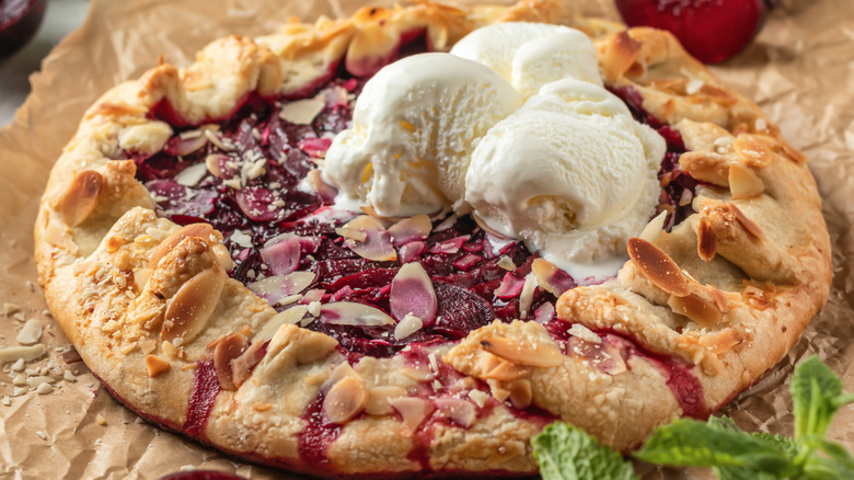 Plum galette with almonds and ice cream