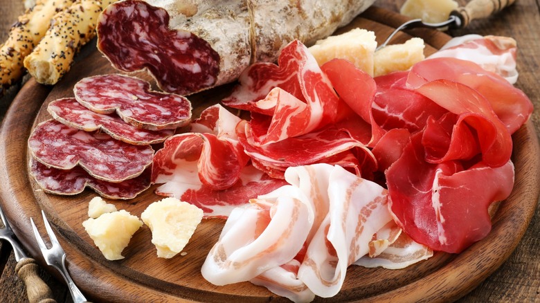 Charcuterie platter with various meats and cheeses