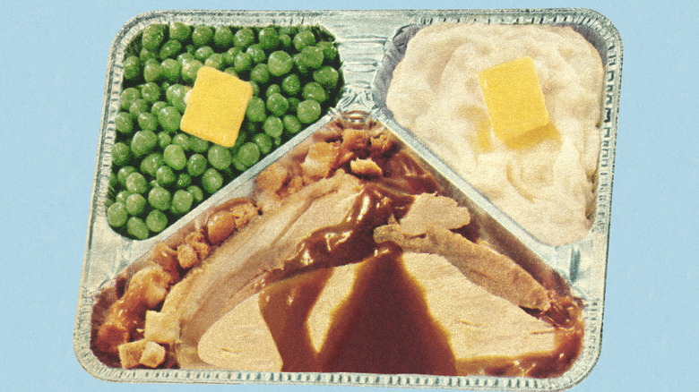 Vintage turkey TV dinner in aluminum try with peas and mashed potatoes