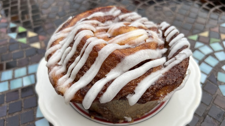 glazed cinnamon roll on a white plate