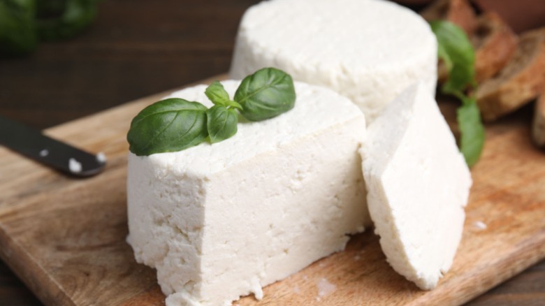 Ricotta cheese on a wooden board.