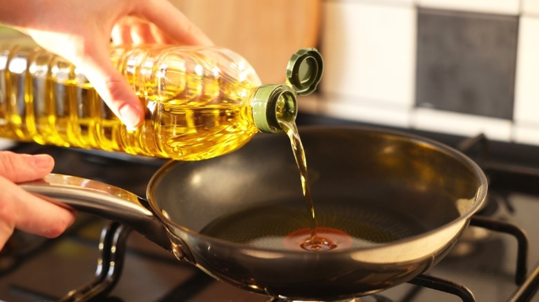 Vegetable oil being poured into a pan