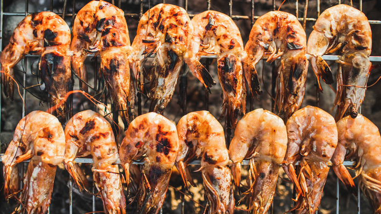 Grilled shrimp cooking on a barbecue grill
